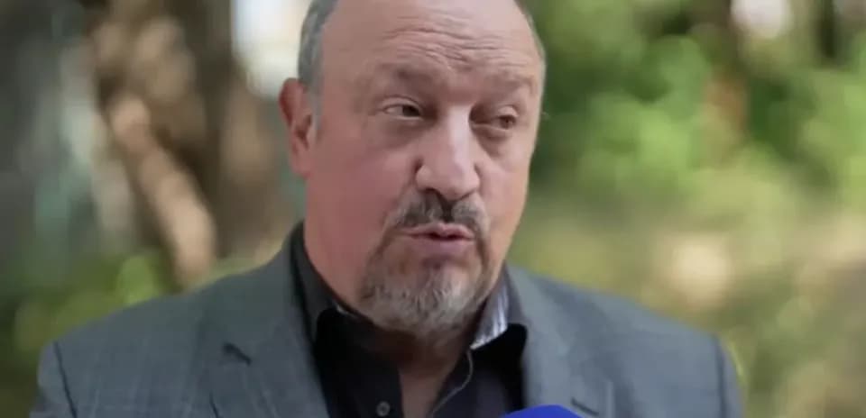 Man speaking during outdoor interview with microphone