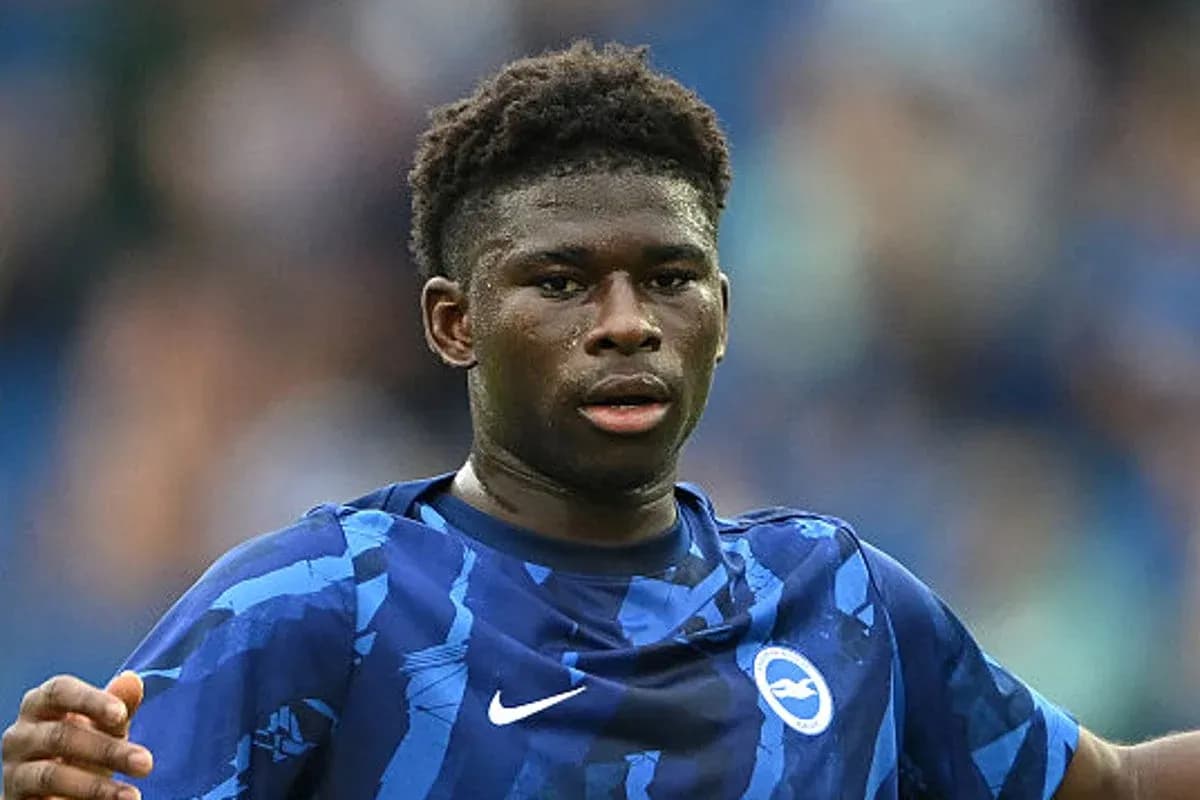 Player wearing Brighton kit during match action