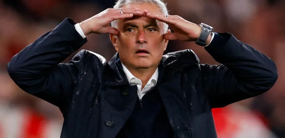 Coach gesturing during a football match