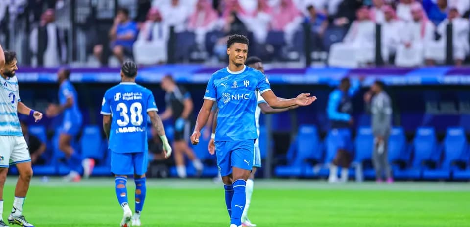 Player gesturing during a football match on field