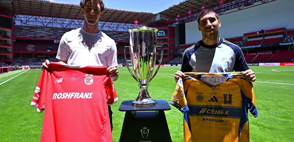 Players holding jerseys before CONCACAF Champions League