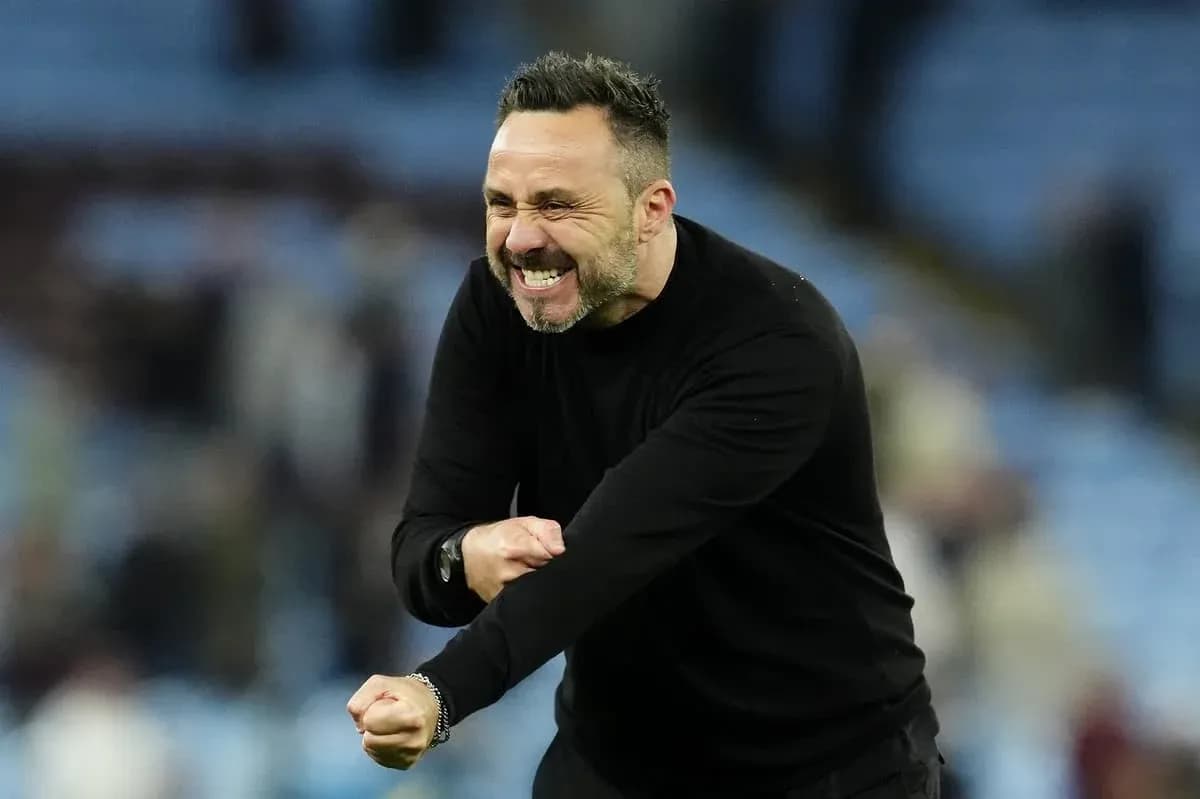 Coach celebrating enthusiastically on the sidelines