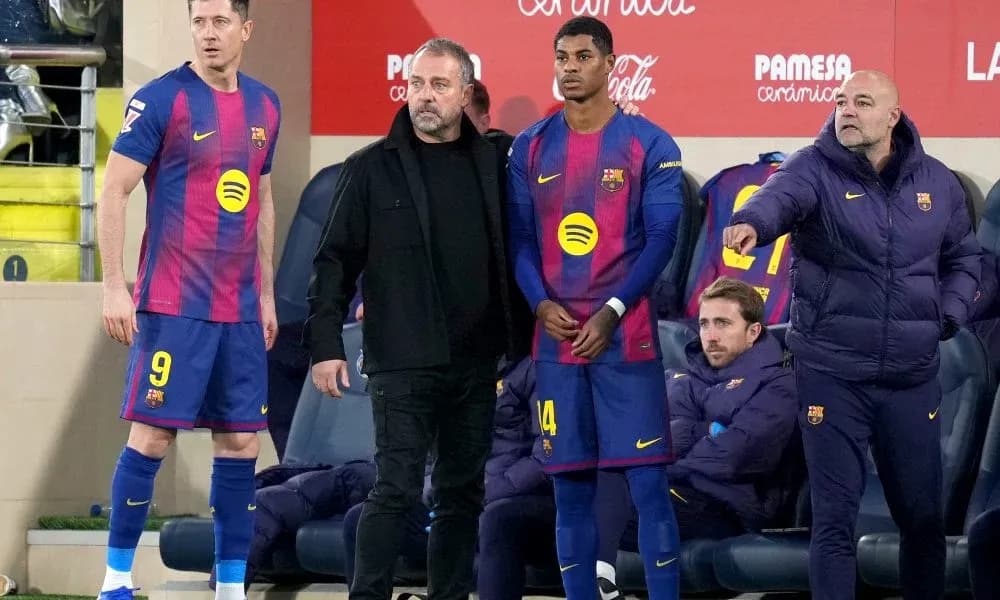 Barcelona players and coach at the bench during match