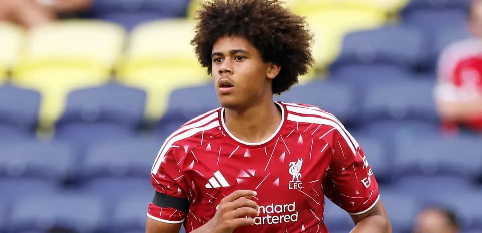 Player warming up in Liverpool jersey before match