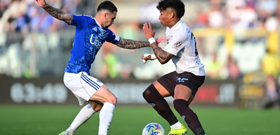 Two players competing for the ball in match