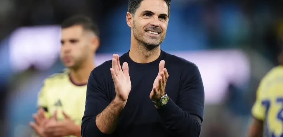 Manager applauding during post-match celebration