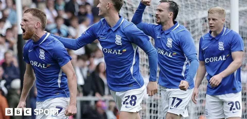Birmingham City players celebrating a goal on pitch
