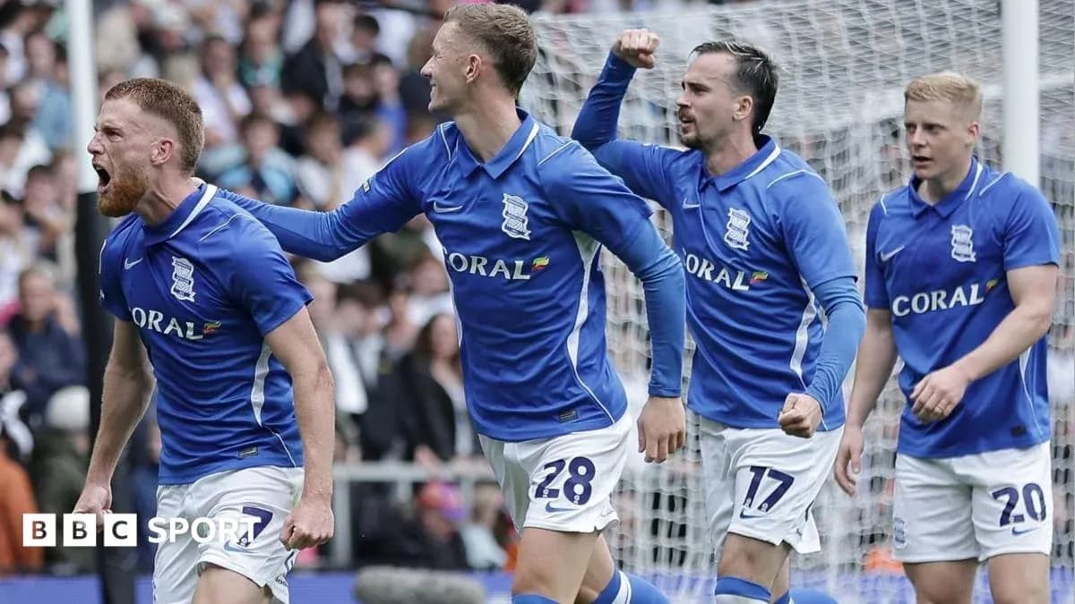 Birmingham City players celebrating a goal on pitch