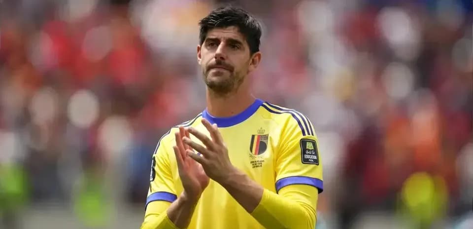 Goalkeeper applauding fans in yellow kit