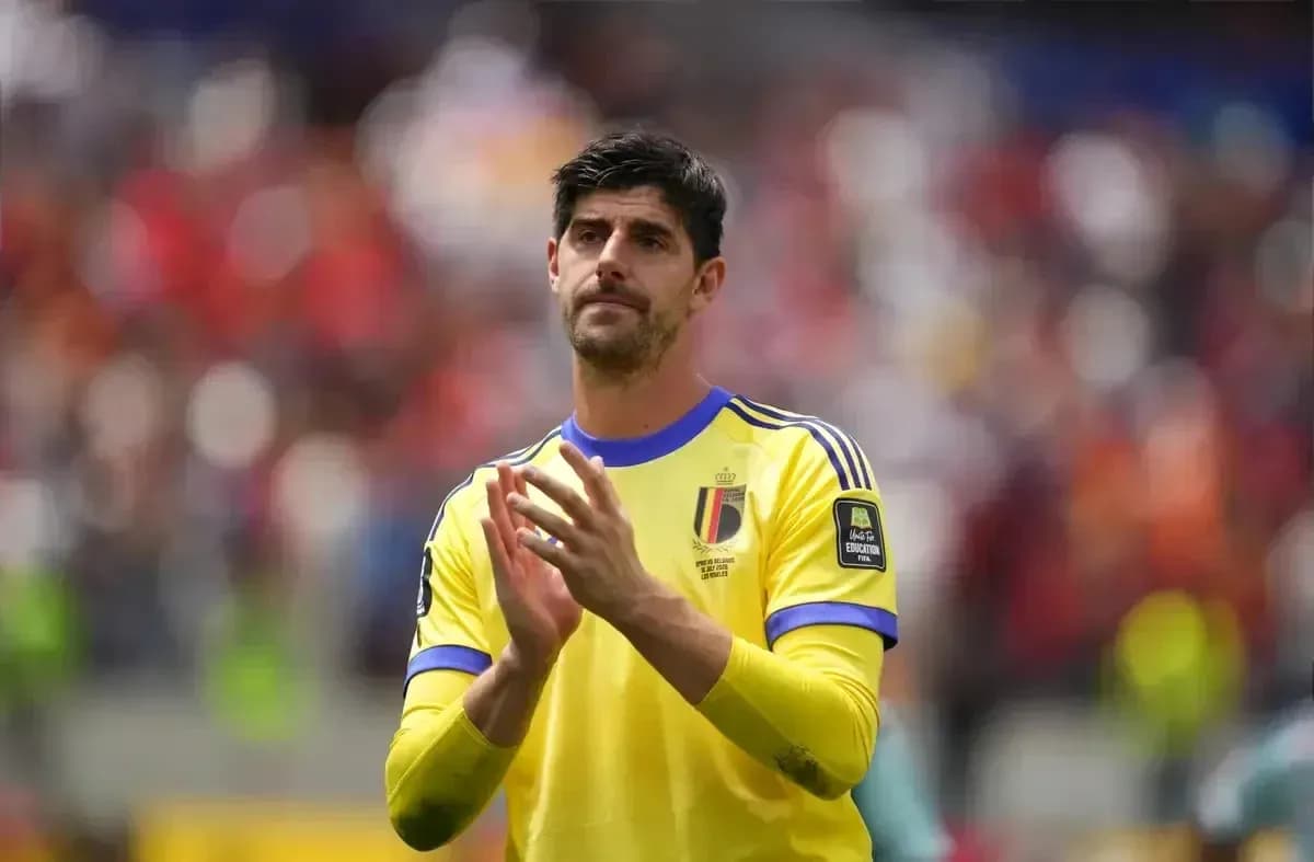 Goalkeeper applauding fans in yellow kit