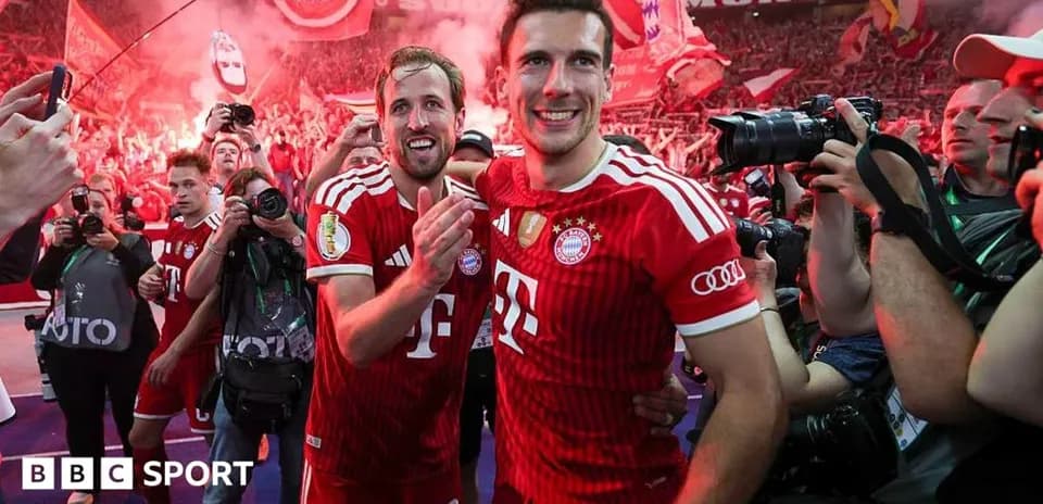 Bayern Munich players celebrating with fans and photographers