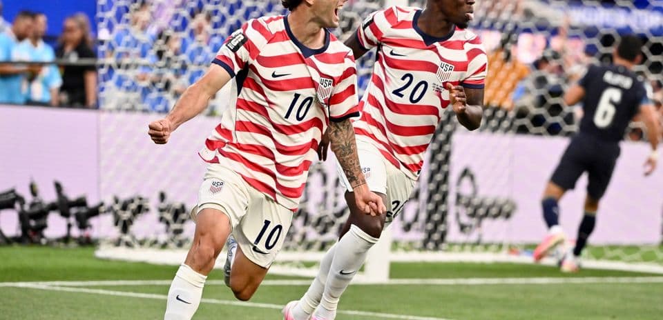 USA players celebrating a goal in World Cup match