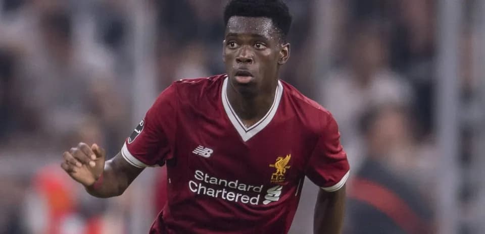 Player in Liverpool kit running during match
