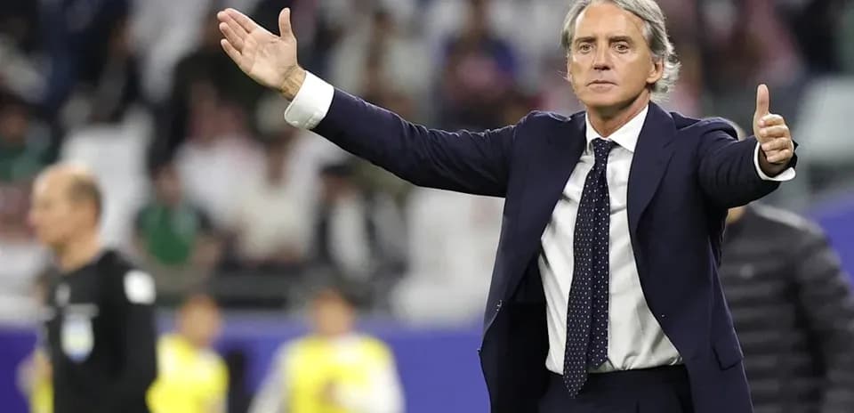Coach gesturing during a football match