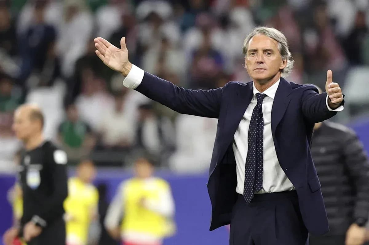 Coach gesturing during a football match