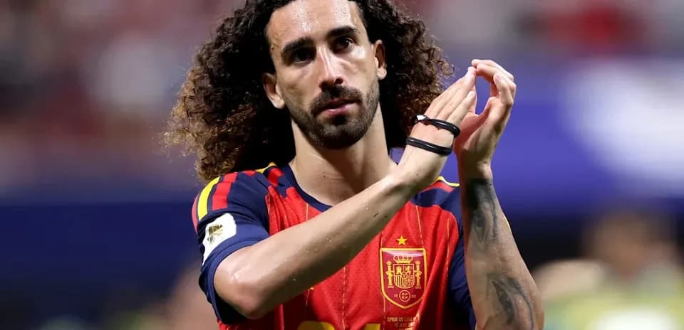 Player applauding fans in Spain national team jersey