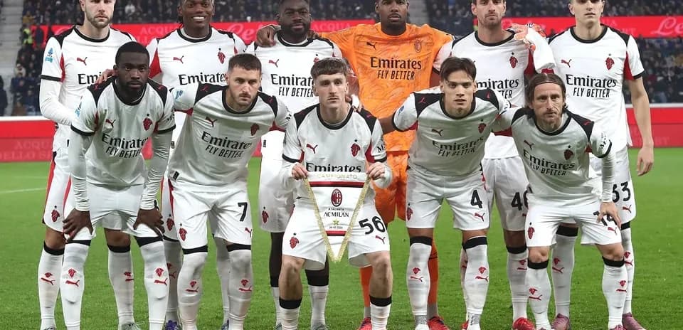 AC Milan team posing before a match