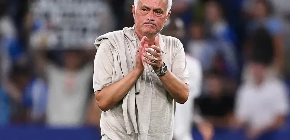 Manager applauding fans after match conclusion