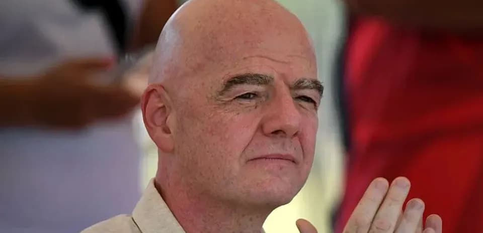 Man with bald head sitting and observing event