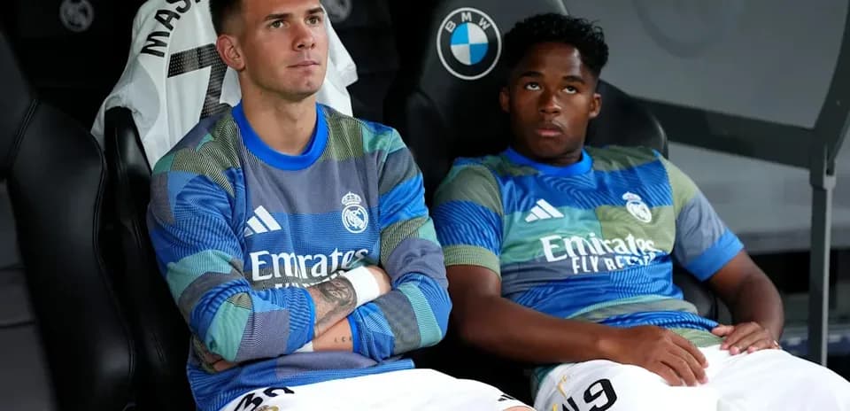 Two Real Madrid players sitting on bench