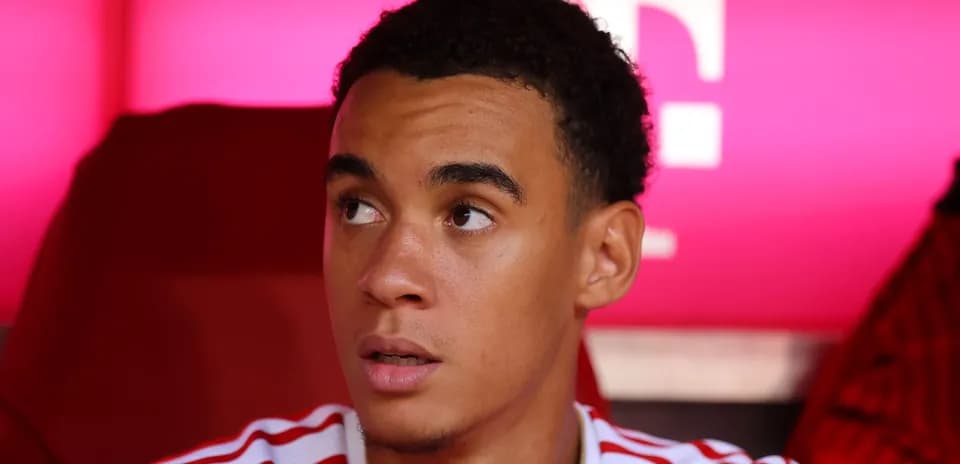 Player seated on bench during match preparation