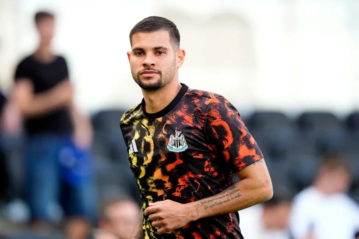 Player in Newcastle training kit during warm-up