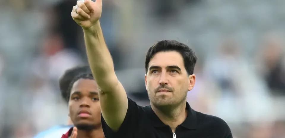 Coach giving thumbs up after match
