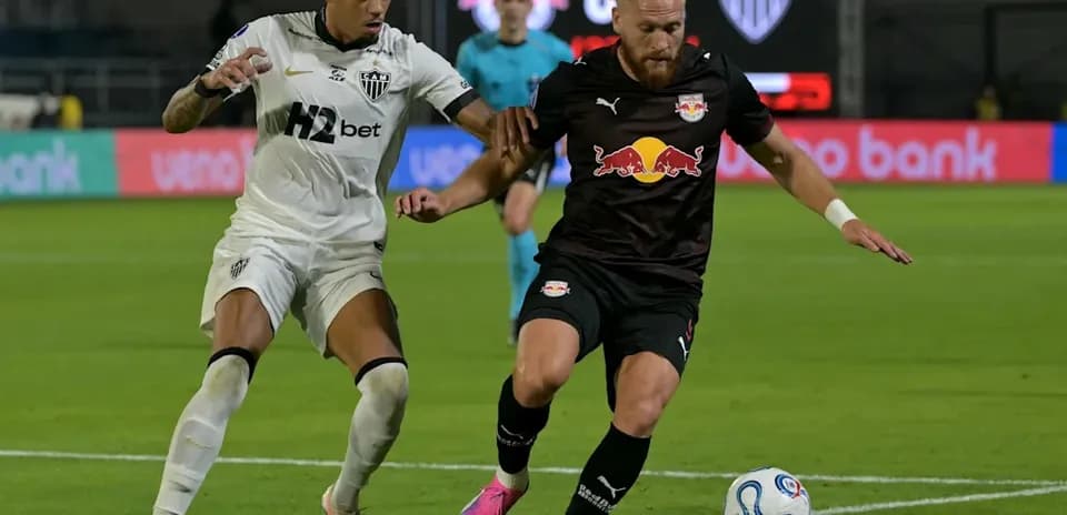 Two players competing for the ball during match