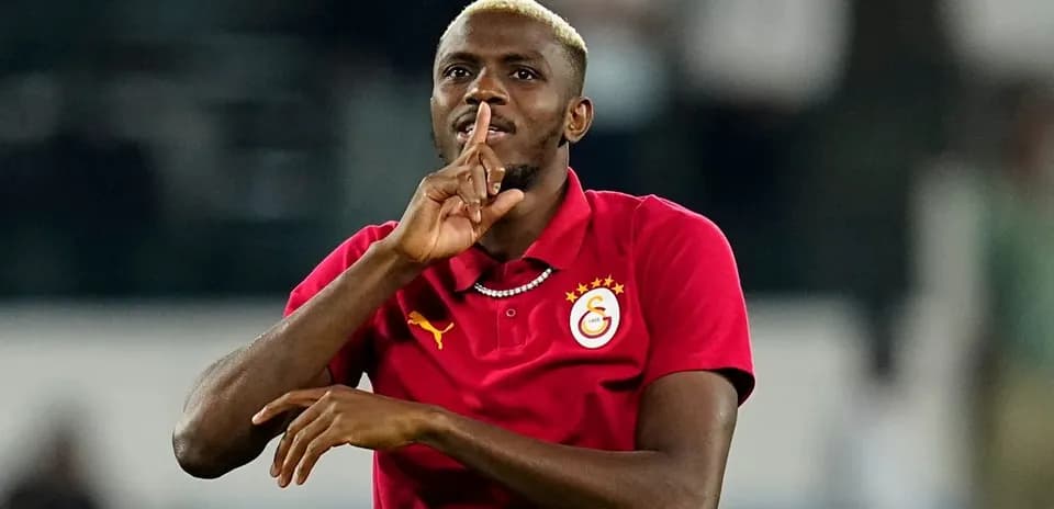Player making shushing gesture during match celebration