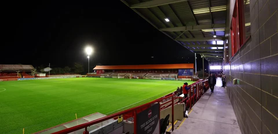 View of football stadium at night with empty field