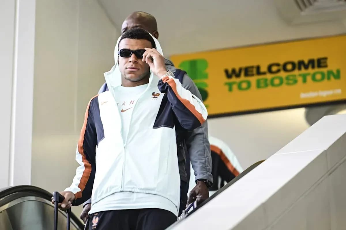 Player arriving at airport escalator in Boston