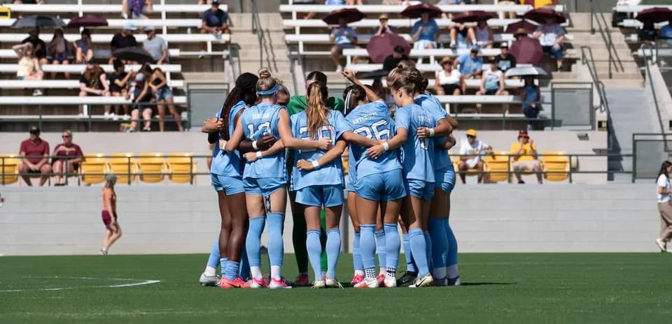 Team huddle before the match on the field