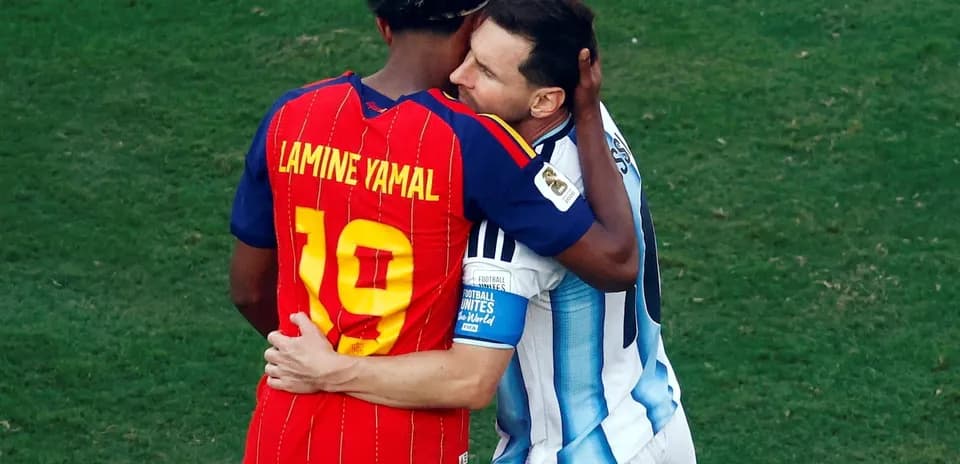 Lamine Yamal embracing Lionel Messi after match