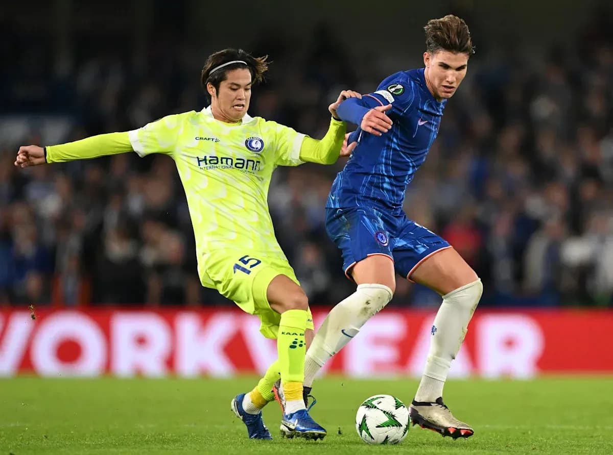 Two players contesting for the ball during match