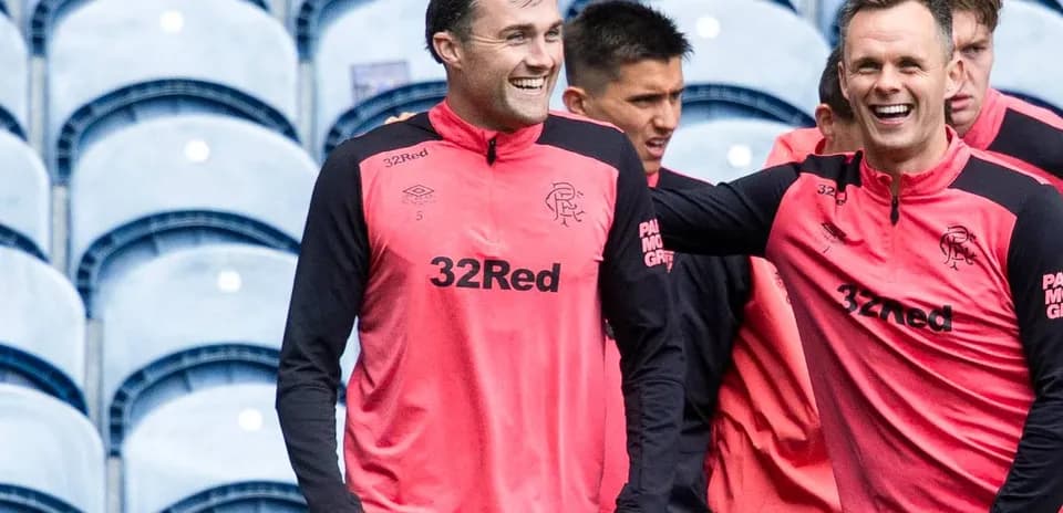 Players laughing during training session at stadium