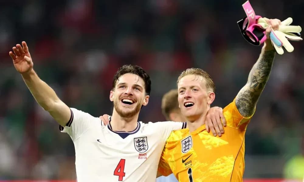 Two England players celebrating after a match