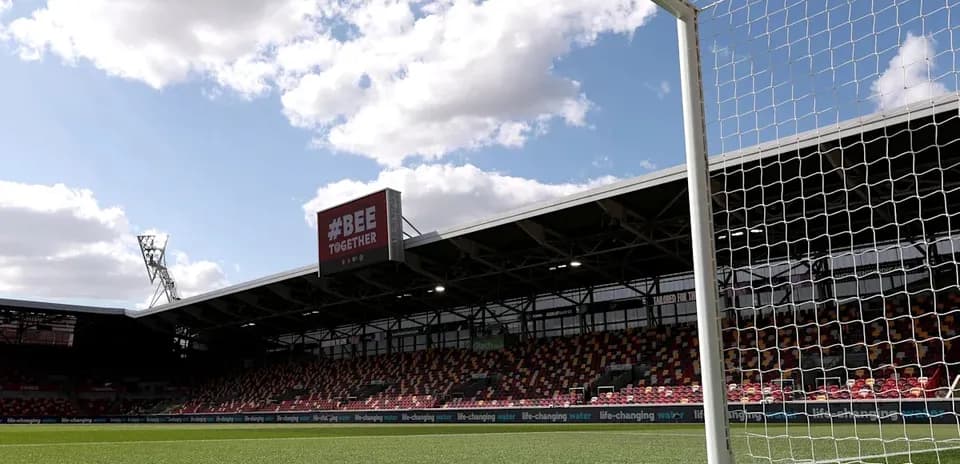 View of goalpost and empty stadium under clouds