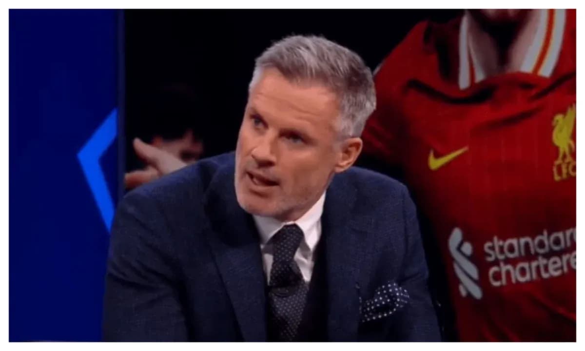 Analyst discussing football in front of Liverpool jersey