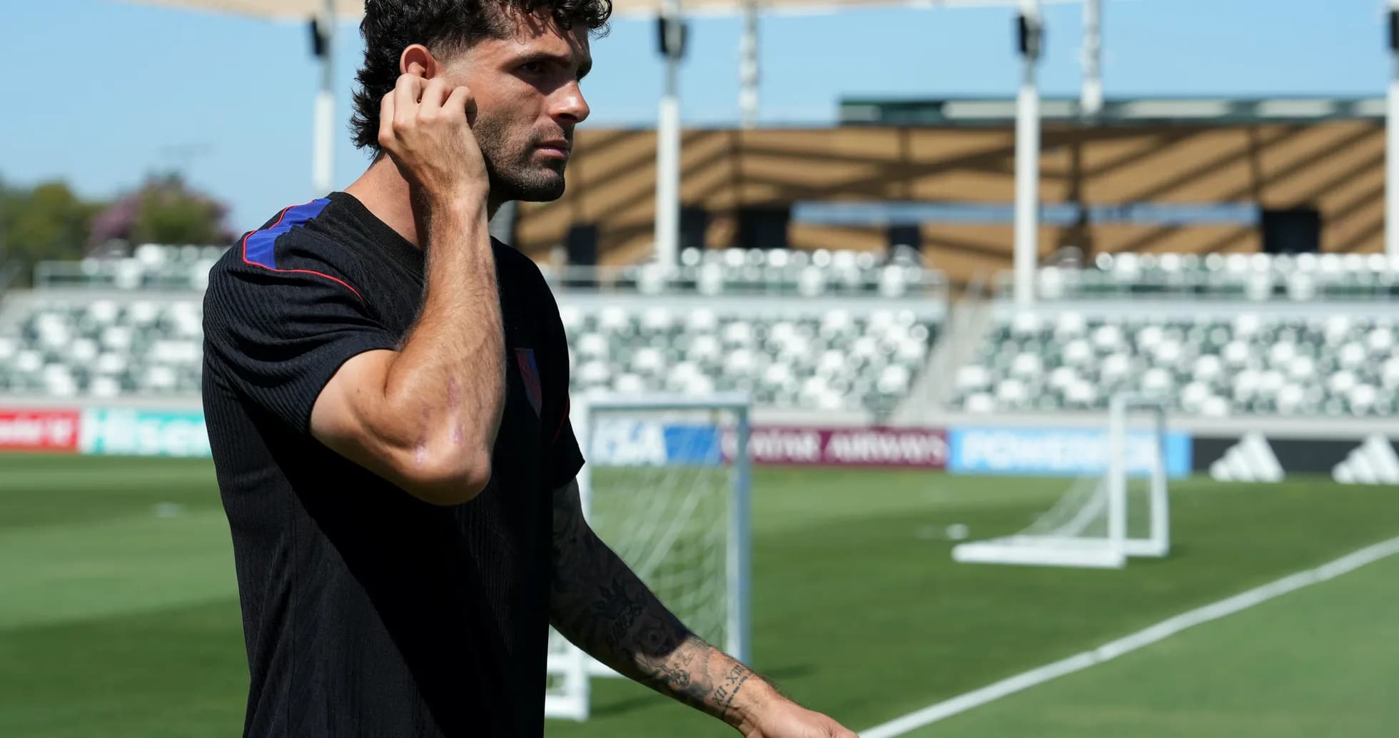 Player walking on training field before match