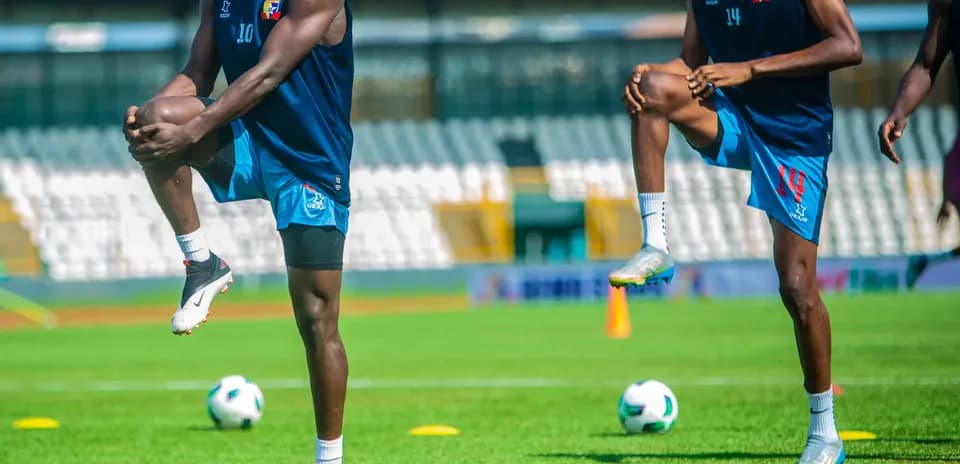 Players stretching during Ikorodu City training session