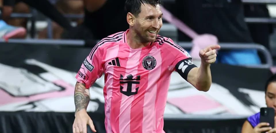 Lionel Messi celebrating in pink Inter Miami jersey