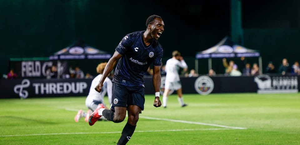 Player celebrating goal during USL match