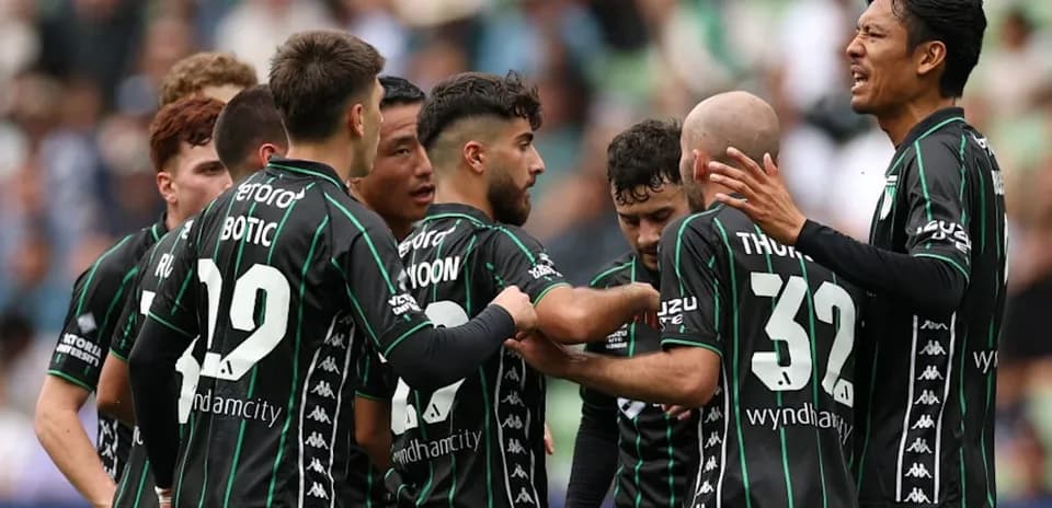 Players celebrating a goal during a match