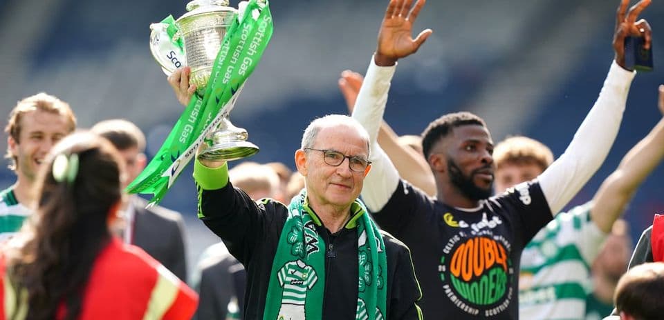 Celtic manager celebrating with Scottish Cup trophy