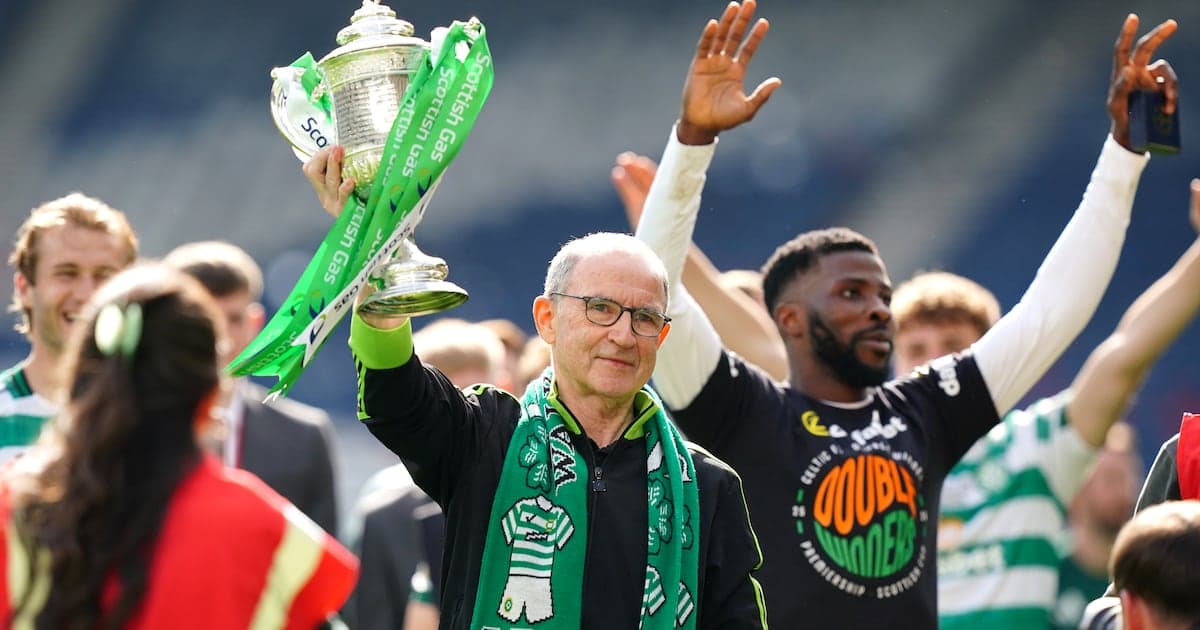 Celtic manager celebrating with Scottish Cup trophy