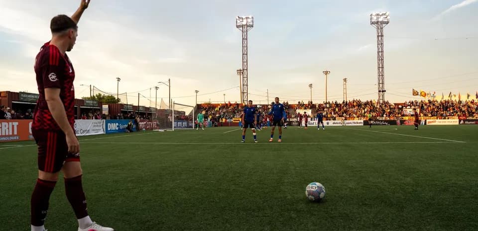 Player preparing for free kick during match