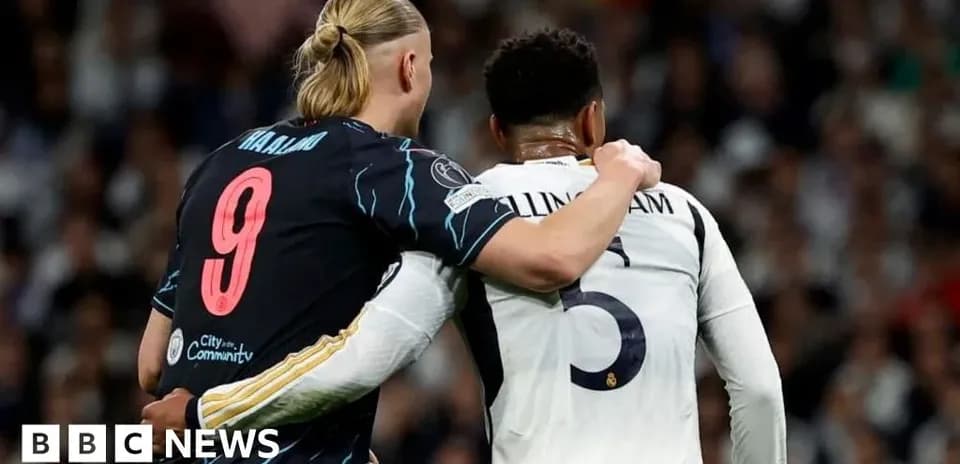 Two players embracing on the football field