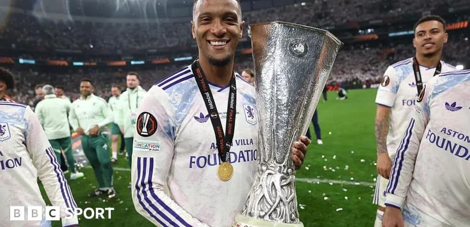 Player celebrating with UEFA trophy after victory