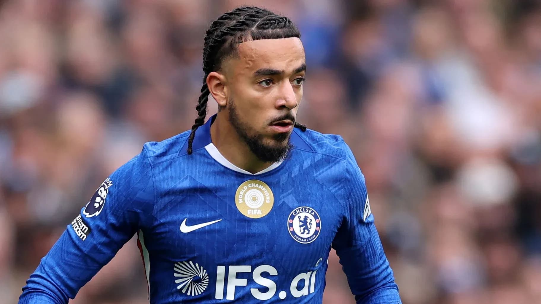 Chelsea player in blue kit during match action