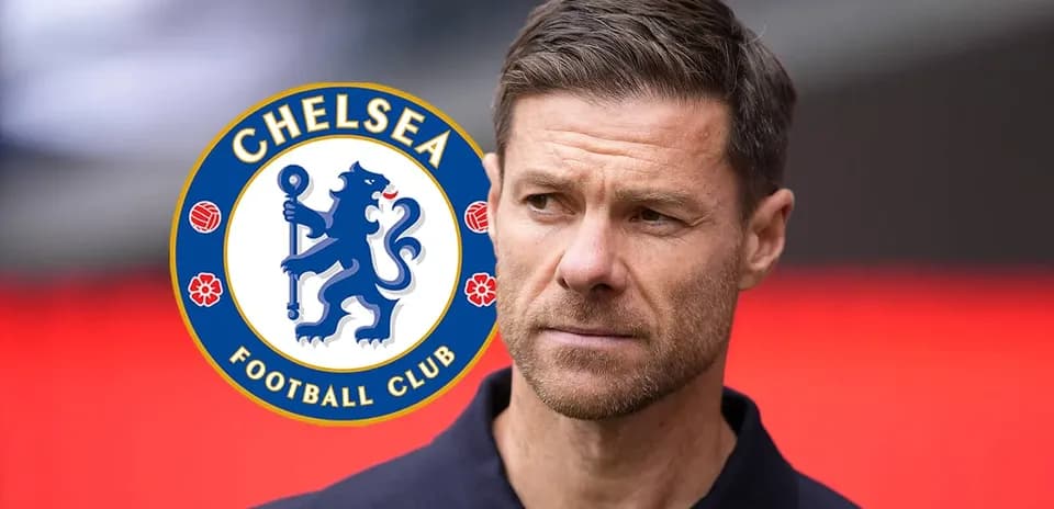 Man in front of Chelsea Football Club logo